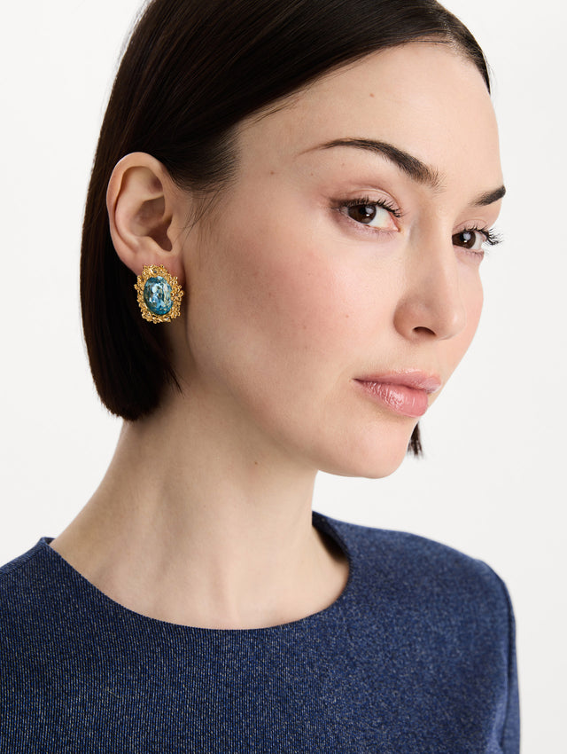 The Oval Medallion Clip-On Earrings in Aqua. Front view.