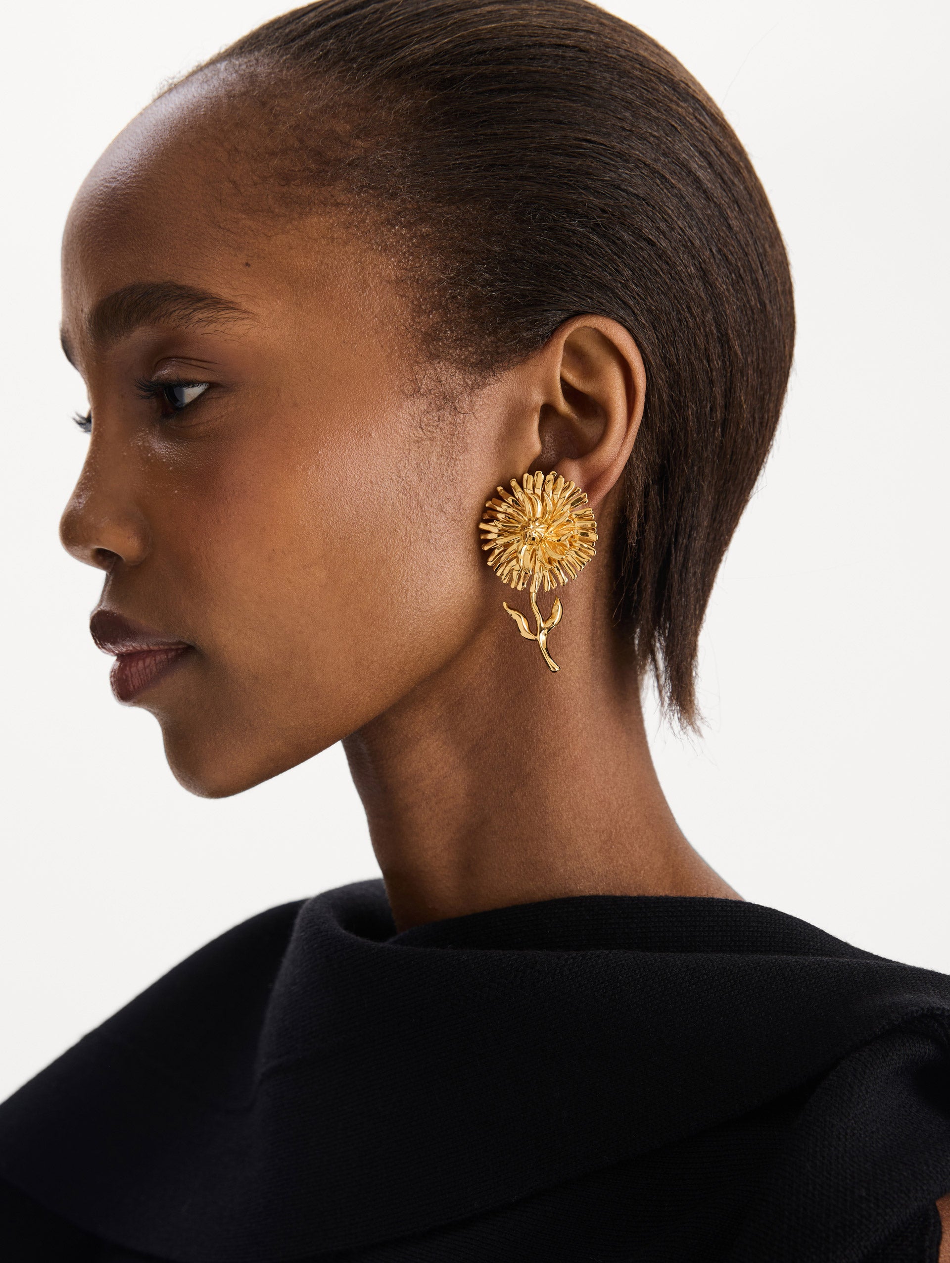 The Daisy Clip-On Earrings in Gold. Front view. 