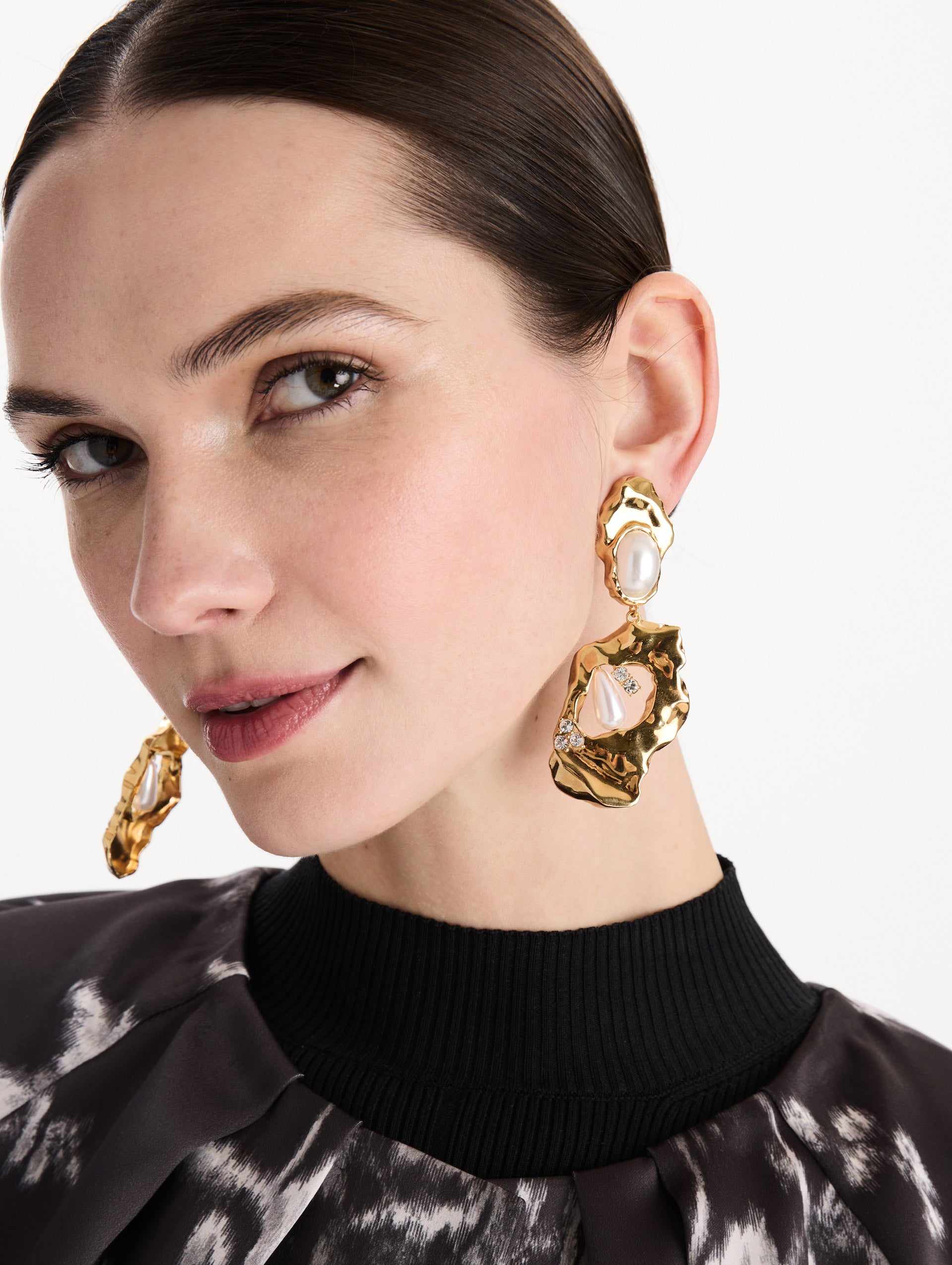 The Hammered Pearl Clip-On Earrings in Pearl. Front view. 