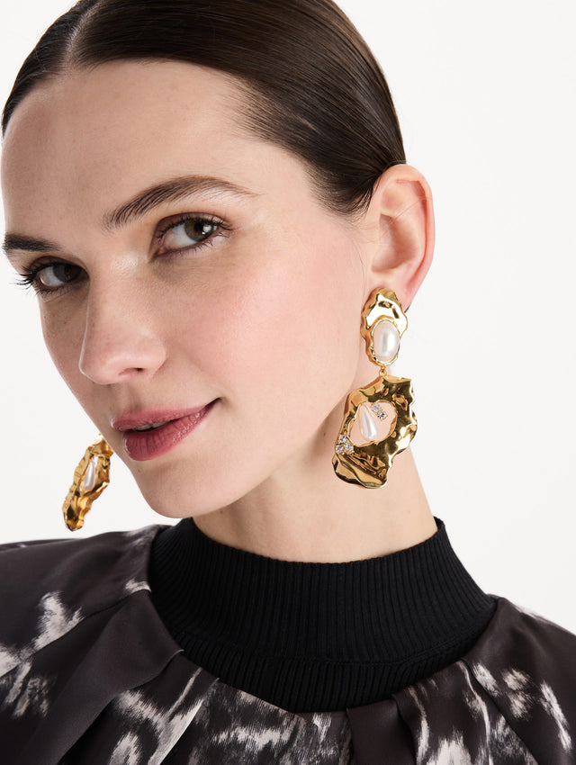 The Hammered Pearl Clip-On Earrings in Pearl. Front view. 