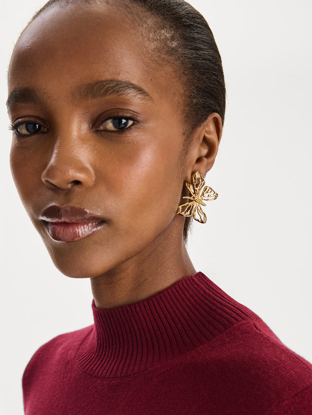 The Openwork Butterfly Clip-On Earrings in Gold. Front view.