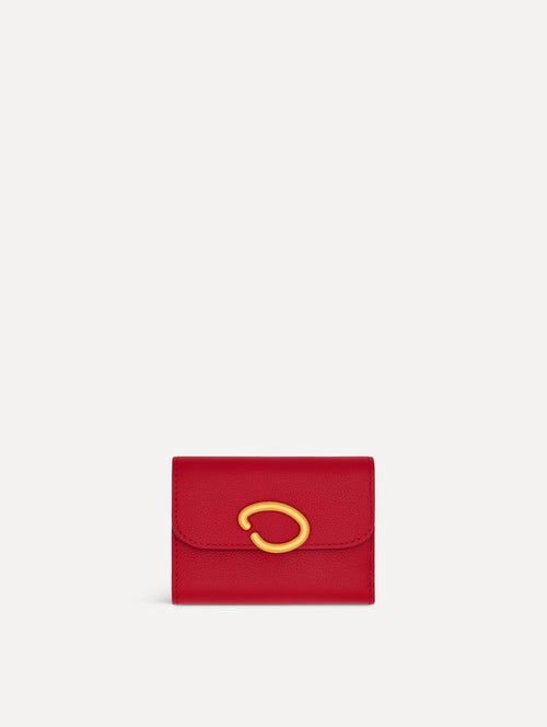 Red Tri-Fold Wallet featuring a gold O motif clasp. Front View.