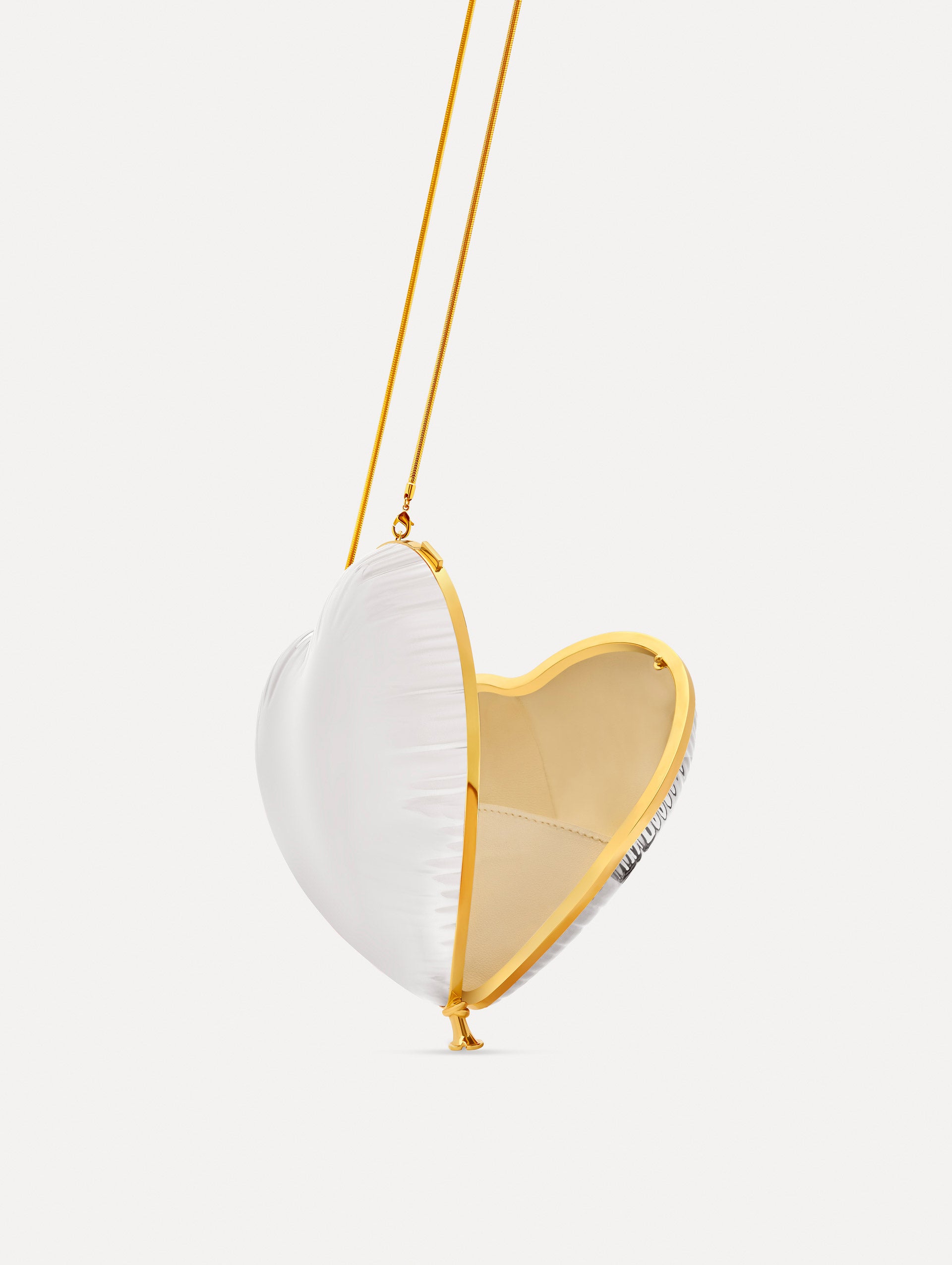 Pearl Heart Ballon Bag featuring a gold chain strap and metallic trim. Side View.