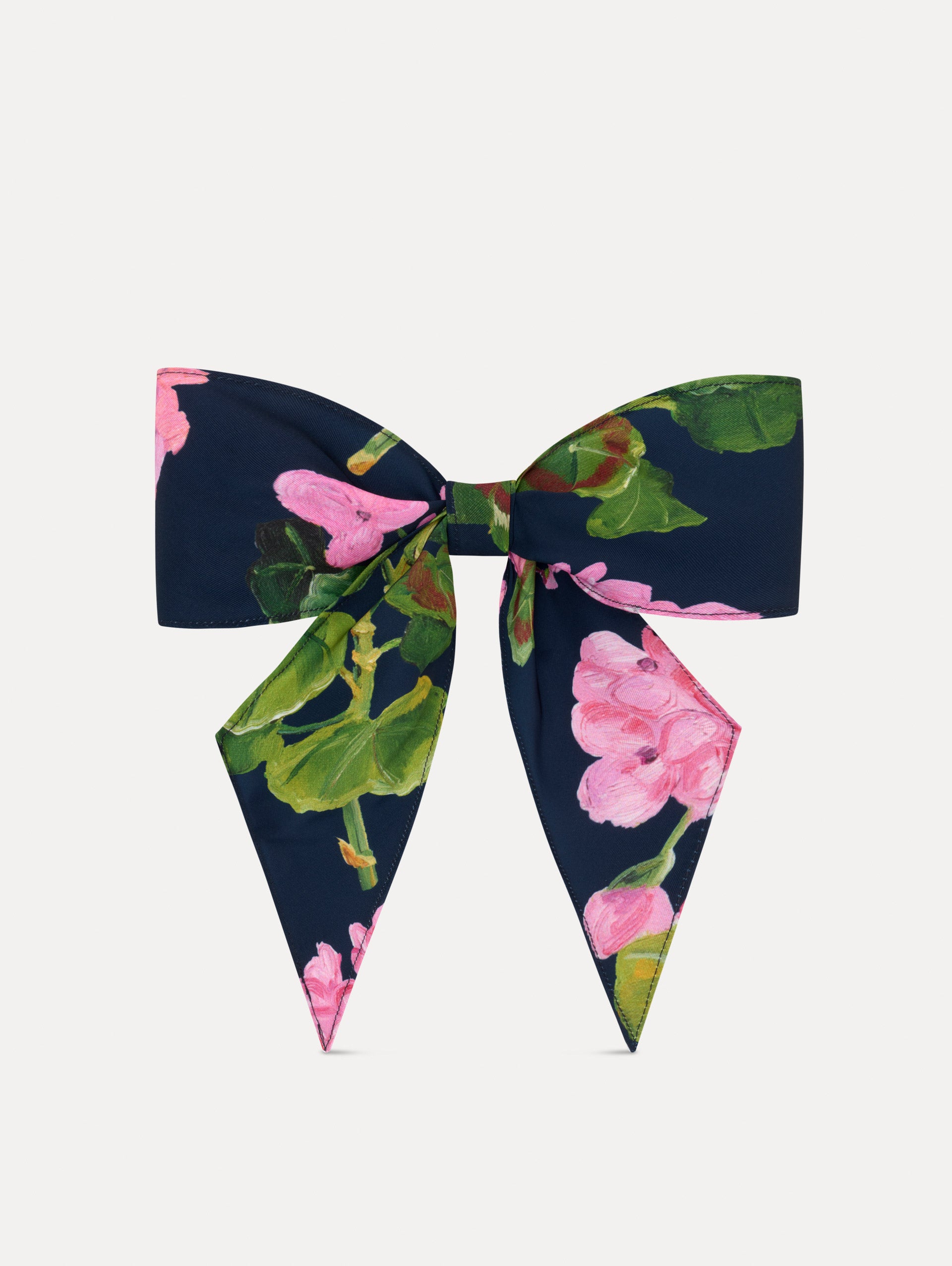 Navy and Pink floral ODLR x @SimonSits Geranium Dog Bow featuring an oversized shape and long pointed tails. Front View.