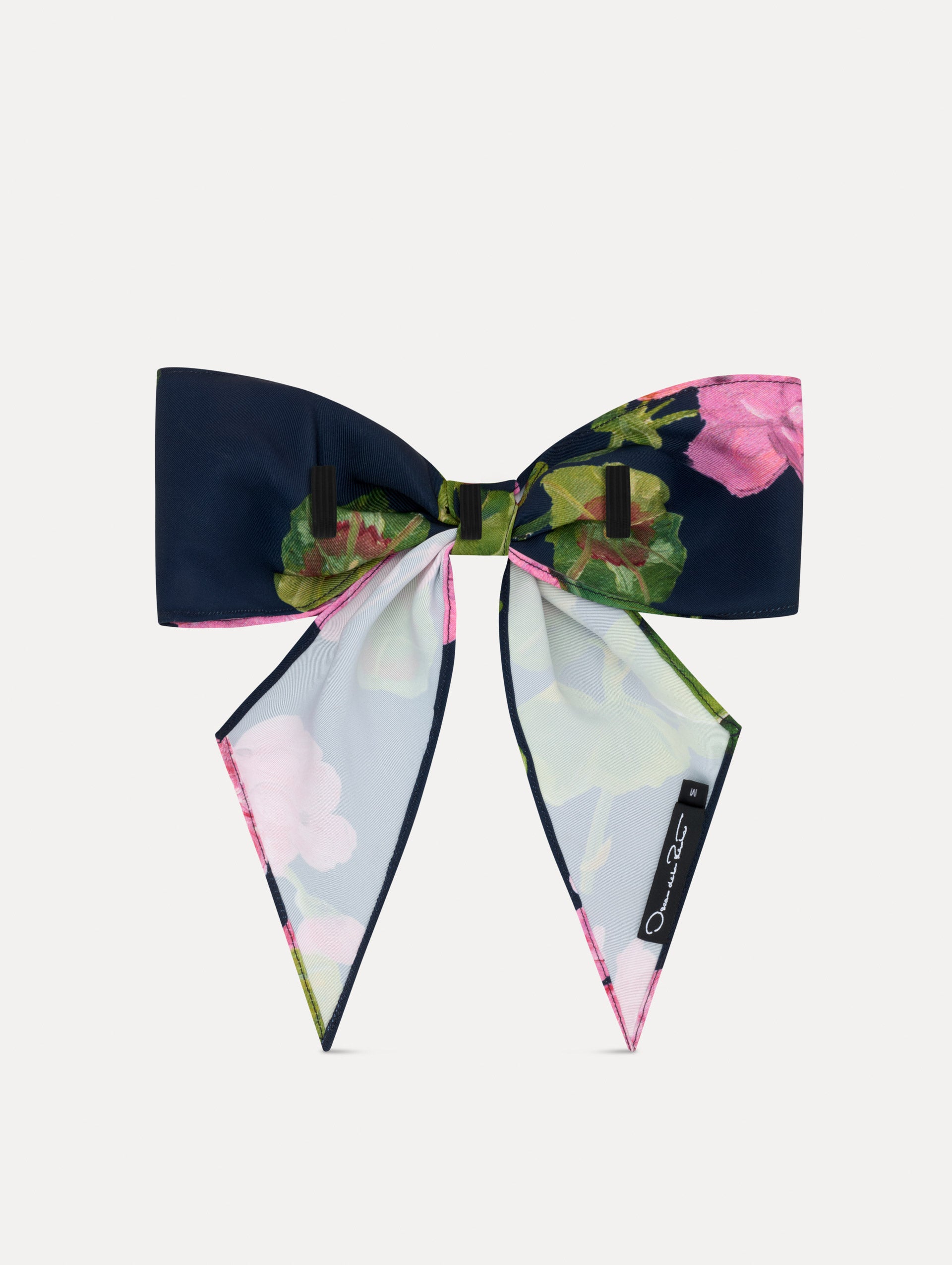 Navy and Pink floral ODLR x @SimonSits Geranium Dog Bow featuring an oversized shape and long pointed tails. Back View.