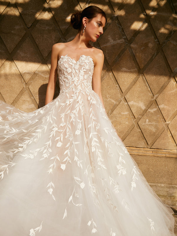 oscar de la renta laser cut wedding dress price Oscar de la Renta Bridal Fall 2026. Faille adorned with sinuous vines of 3D die-cut fil florals. #odlrbridal Discover the collection at the link in bio. Photographed by @_brettwarren_