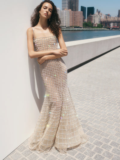 The model is wearing a crystal lattice gown. 