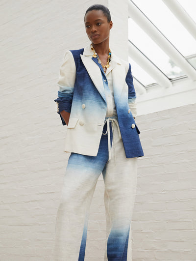 A model wears a blue and white suit set