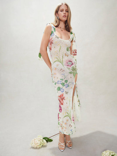 A model poses inside in an Oscar de la Renta floral crochet dress.