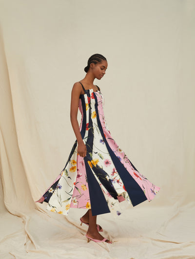 A model wears a dress with stripes and flowers printed