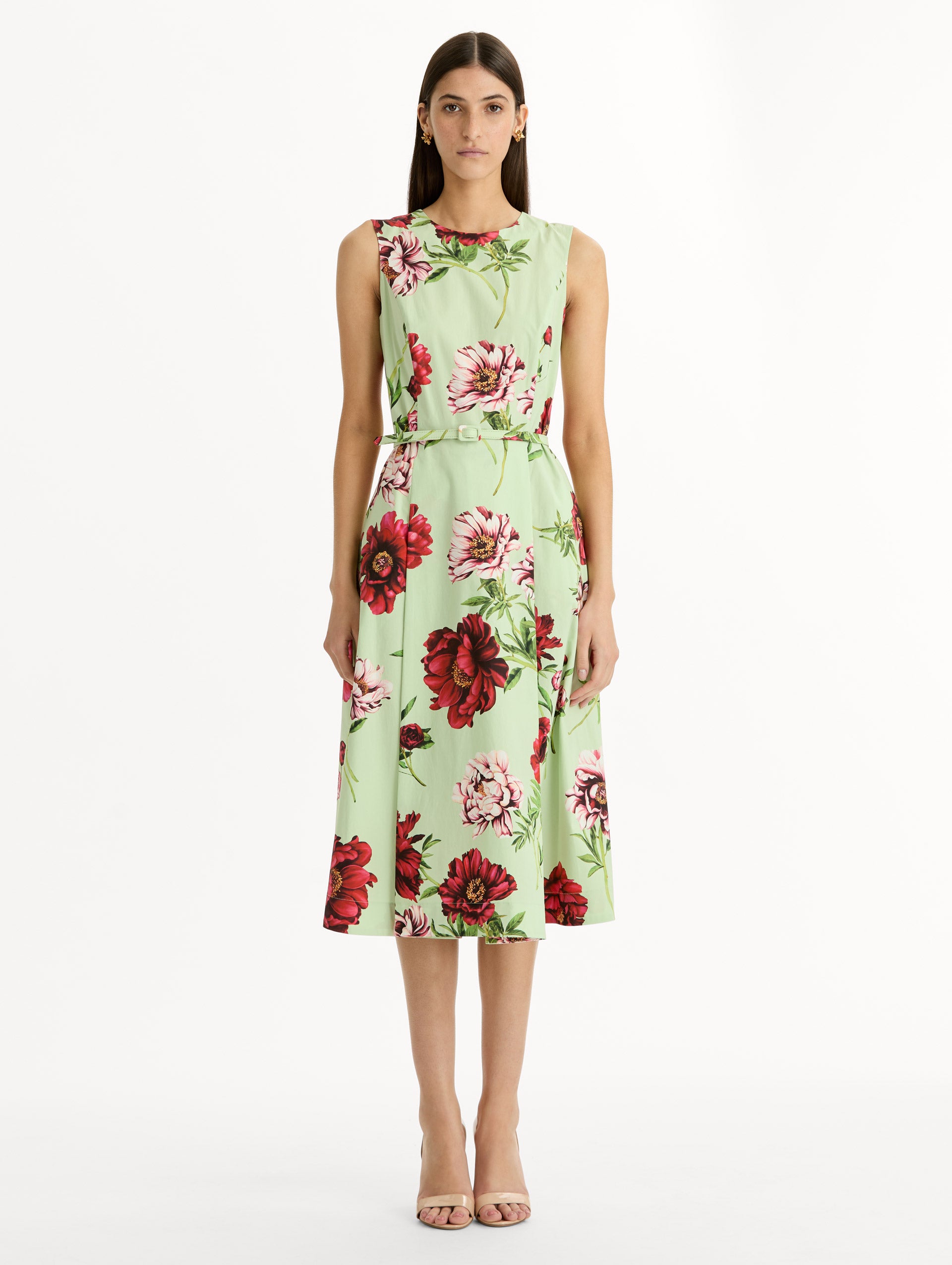 light green Peony Cotton Poplin Sleeveless Dress with belted waist and red floral print. Front View.
