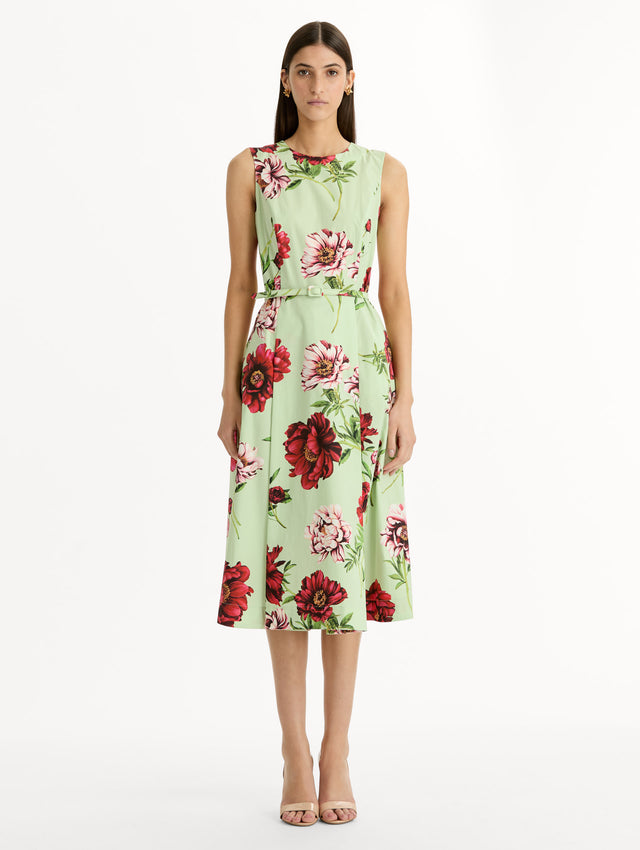 light green Peony Cotton Poplin Sleeveless Dress with belted waist and red floral print. Front View.