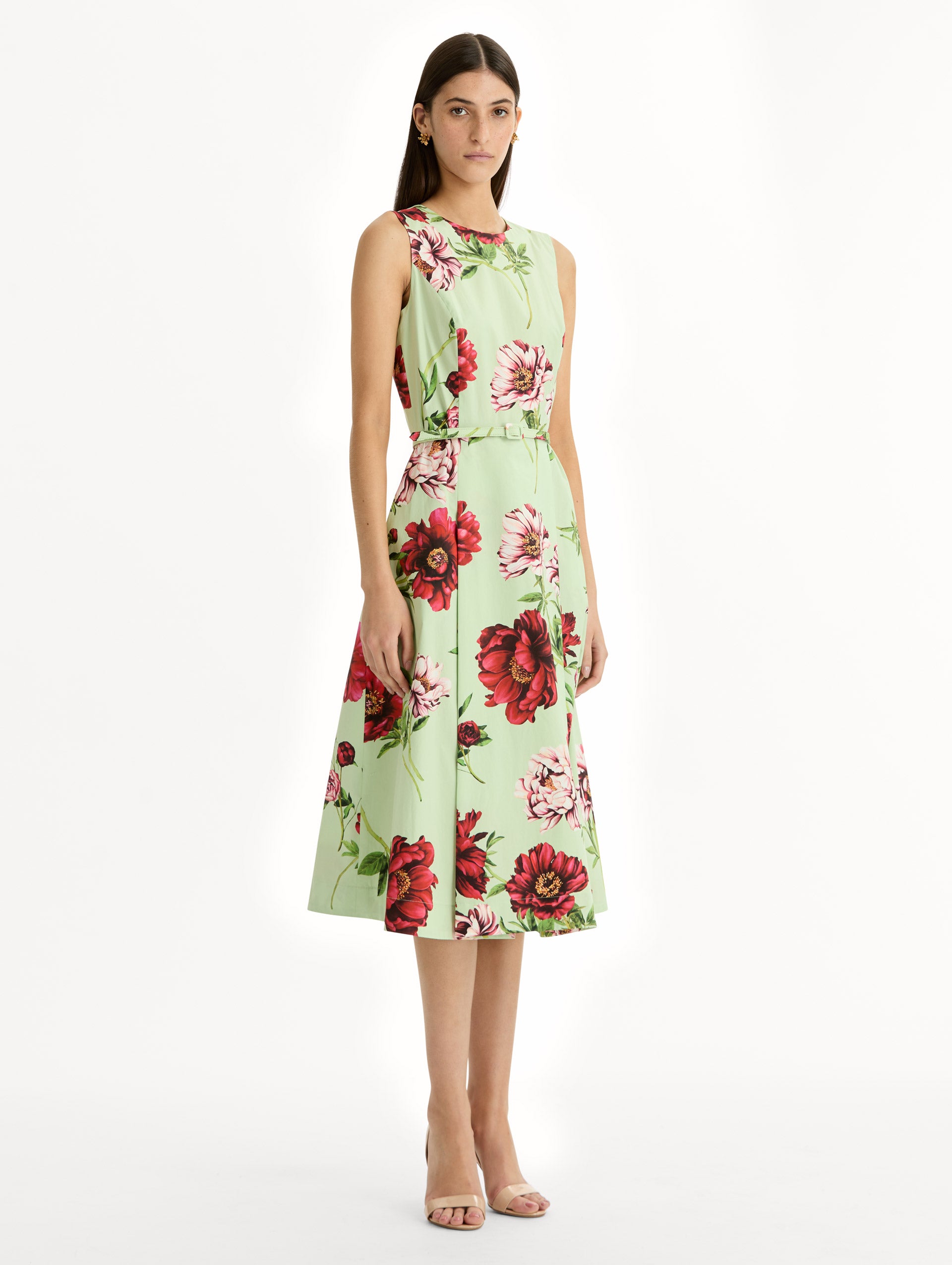 light green Peony Cotton Poplin Sleeveless Dress with belted waist and red floral print. Side View.