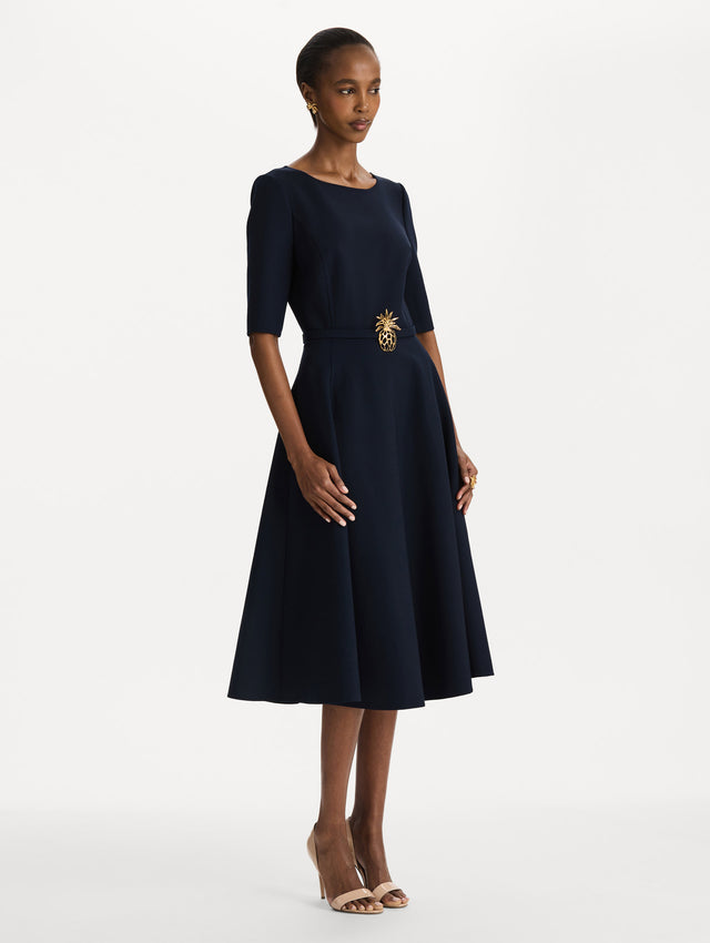 Pineapple Belt Wool Dress in Navy. Side view.