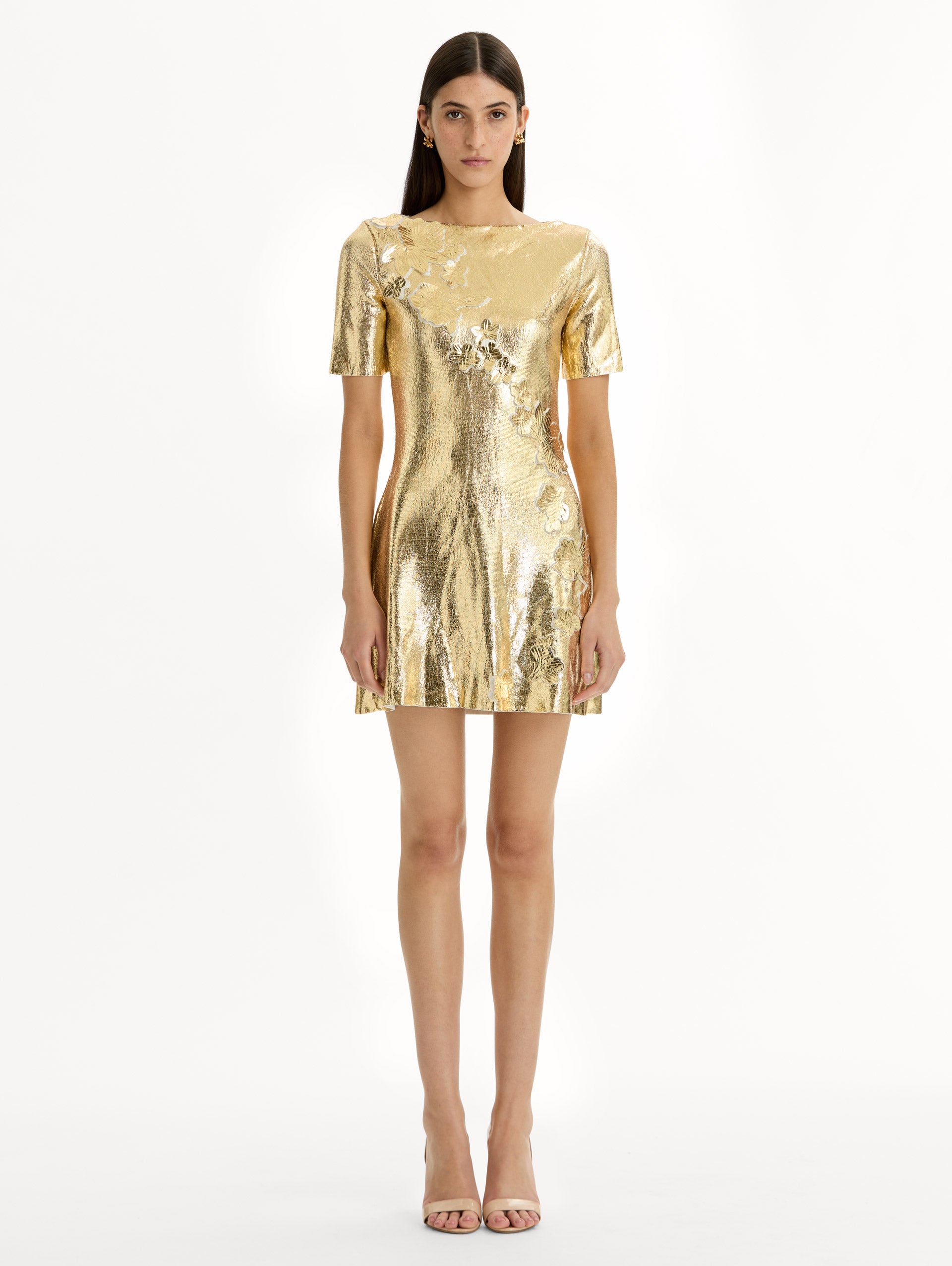 Metallic gold sleeveless mini dress with cherry blossom lace embroidery. Front view.