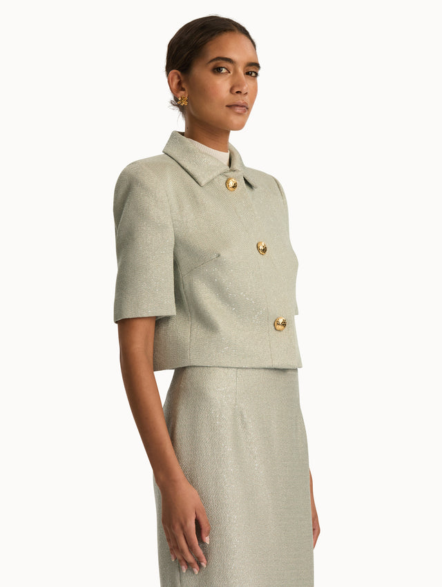 Front view of grey tweed short sleeve jacket. Side view.