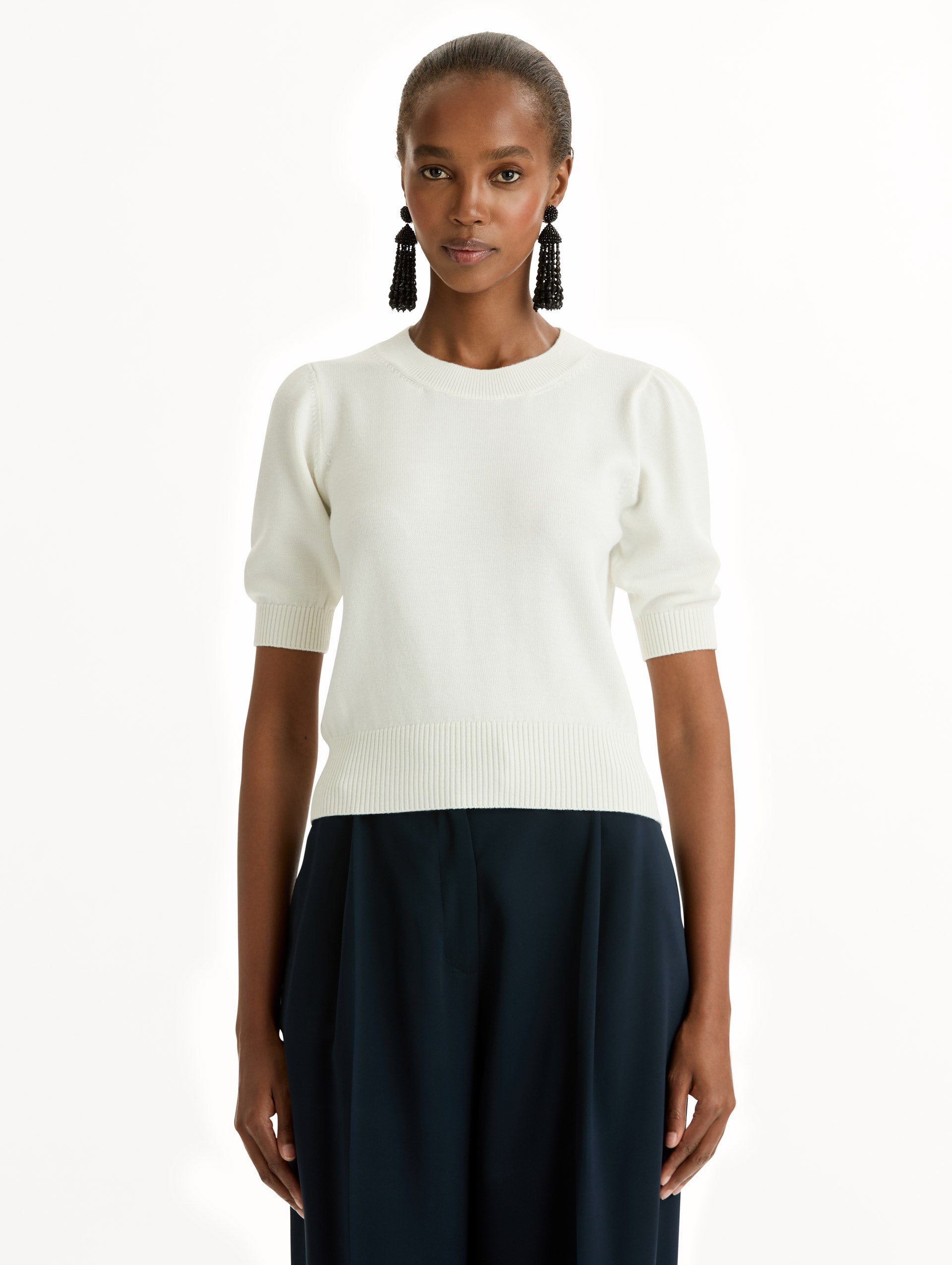 Ivory Short Sleeve Wool Pullover with ribbed neckline and hem. Front View.