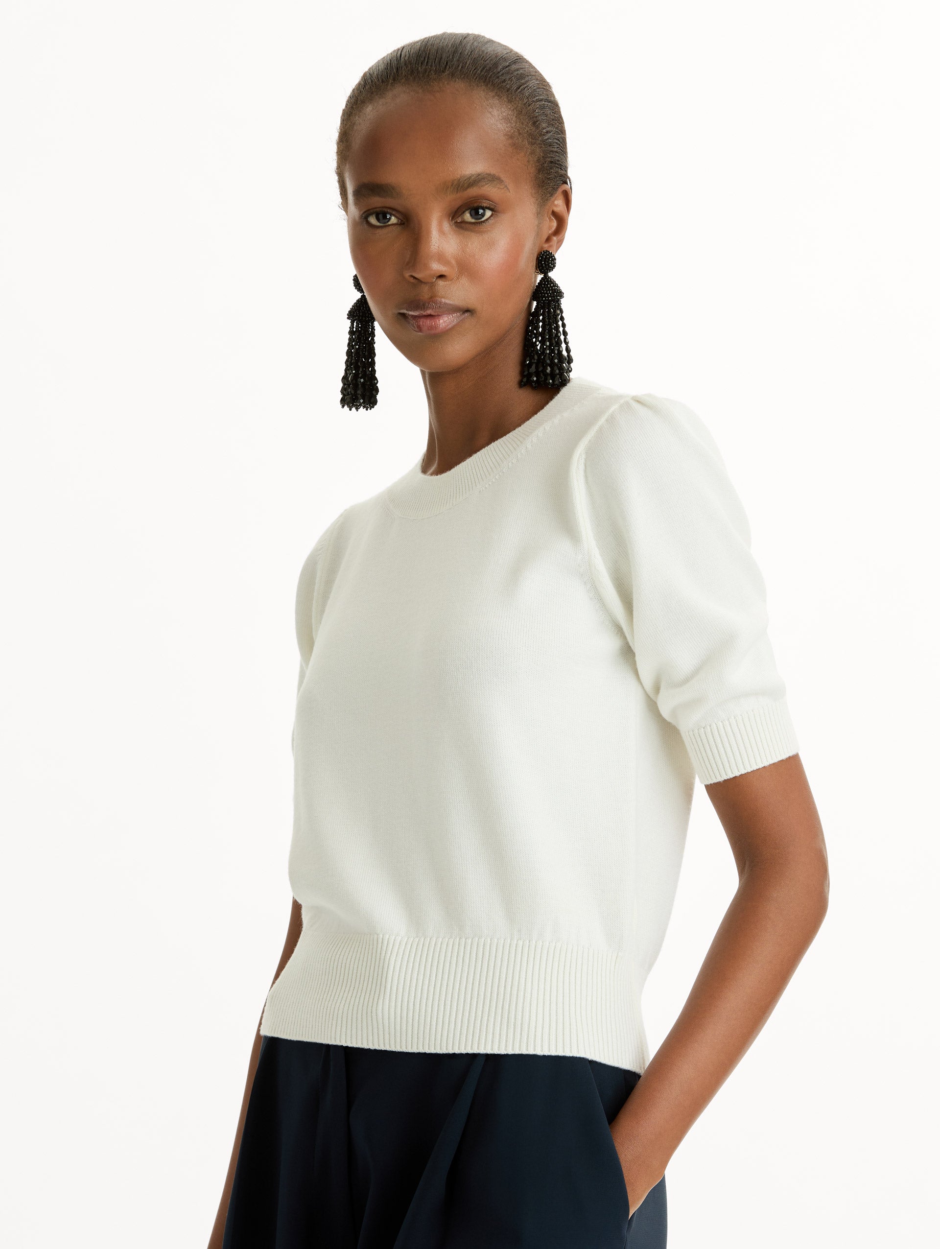 Ivory Short Sleeve Wool Pullover with ribbed neckline and hem. Zoom View.