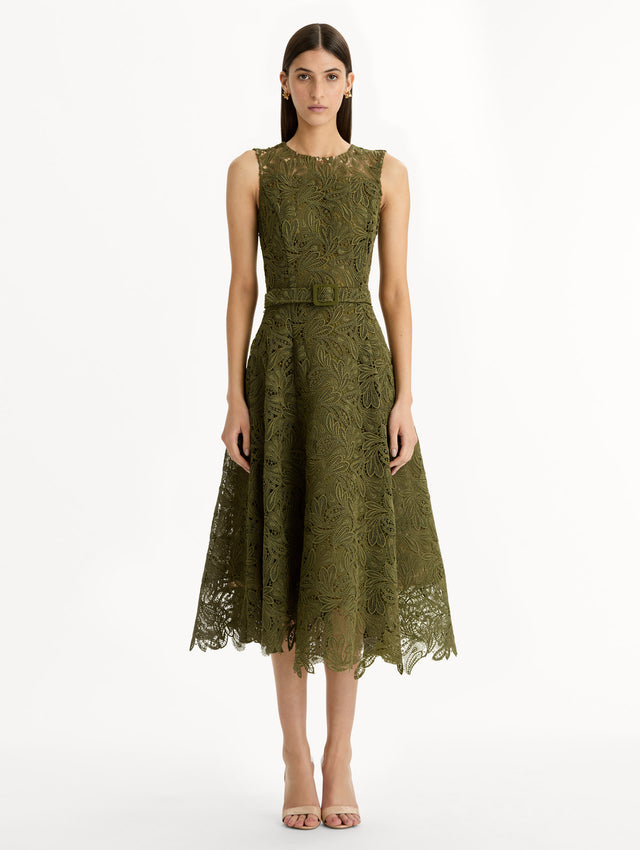 Moss Feather Scroll Guipure Dress with belted waist and sleeveless bodice. Front View.