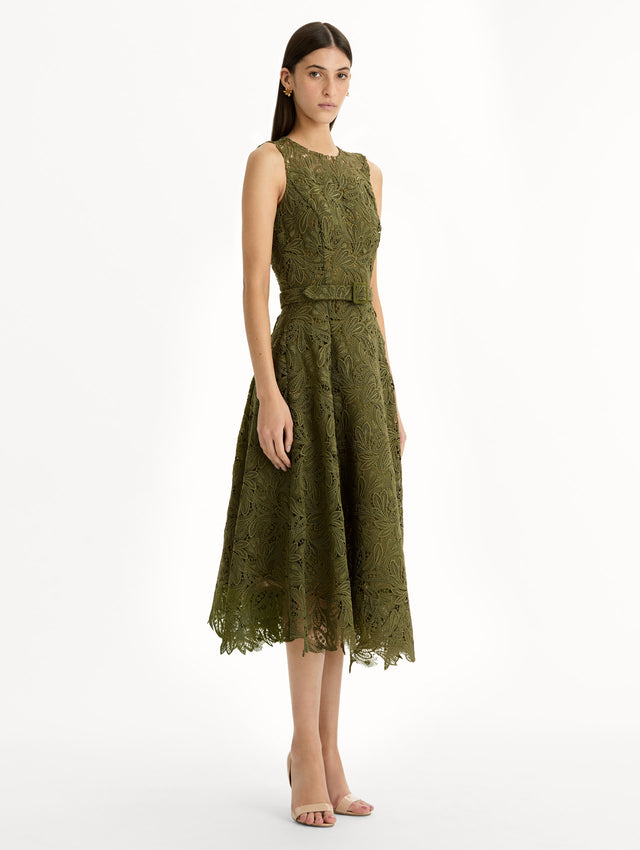 Moss Feather Scroll Guipure Dress with belted waist and sleeveless bodice. Side View.