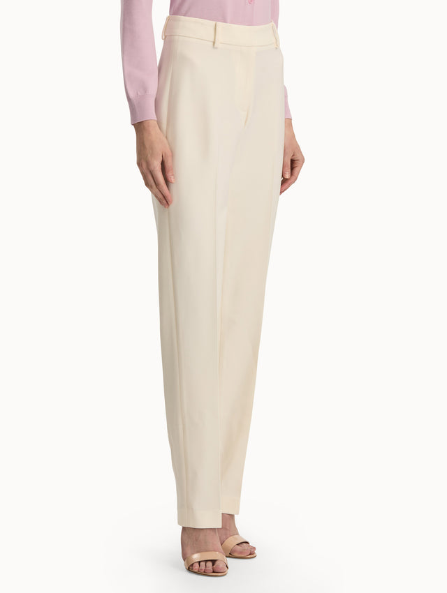 Front view of straight leg ivory pants. Side view.