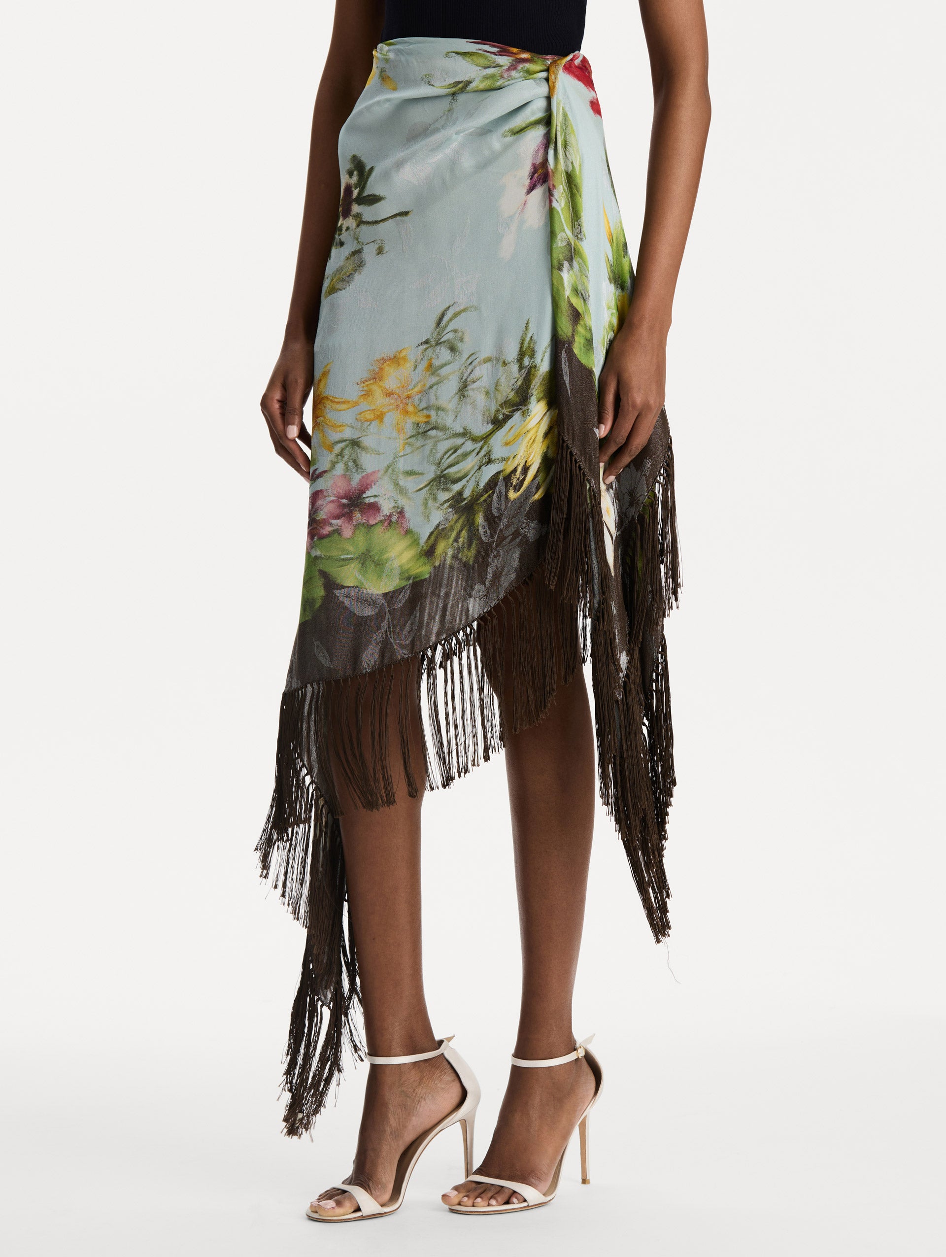 Dominican Mixed-Floral Fringe Skirt in Light Blue Multi. Side View.