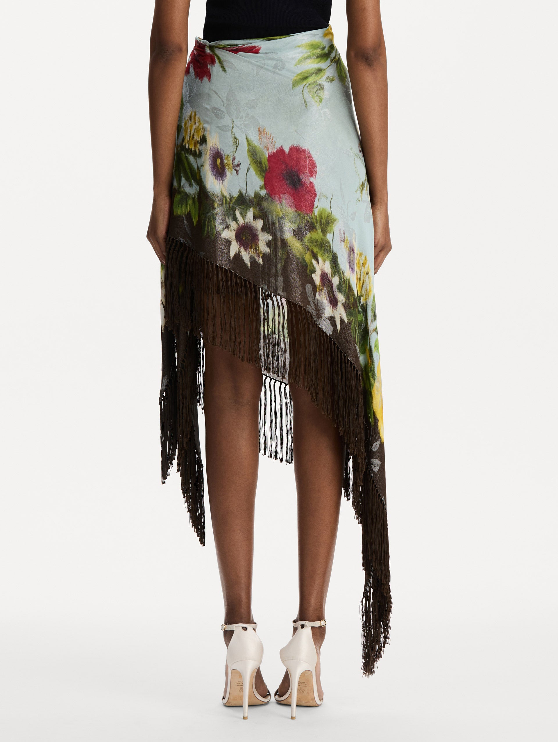 Dominican Mixed-Floral Fringe Skirt in Light Blue Multi. Back View.