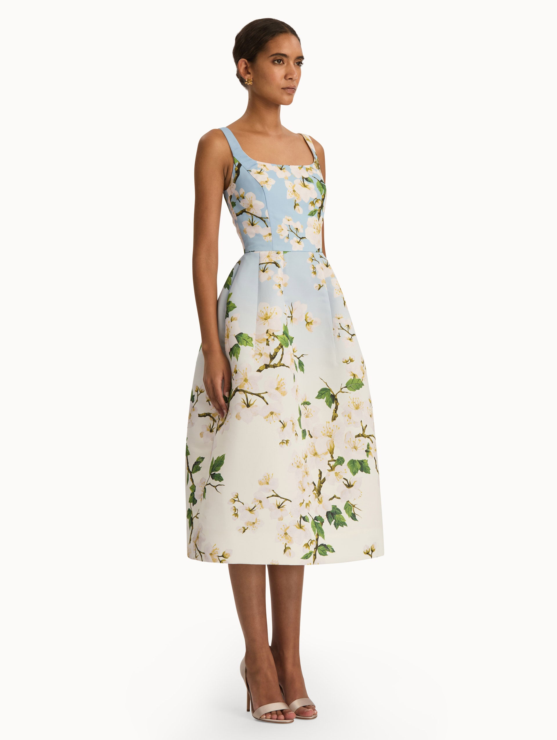 Front view of cherry blossom dress with a blue to white ombre. Side view.