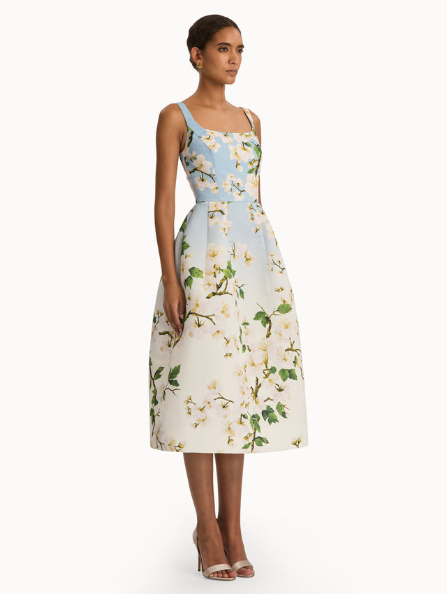 Front view of cherry blossom dress with a blue to white ombre. Side view.