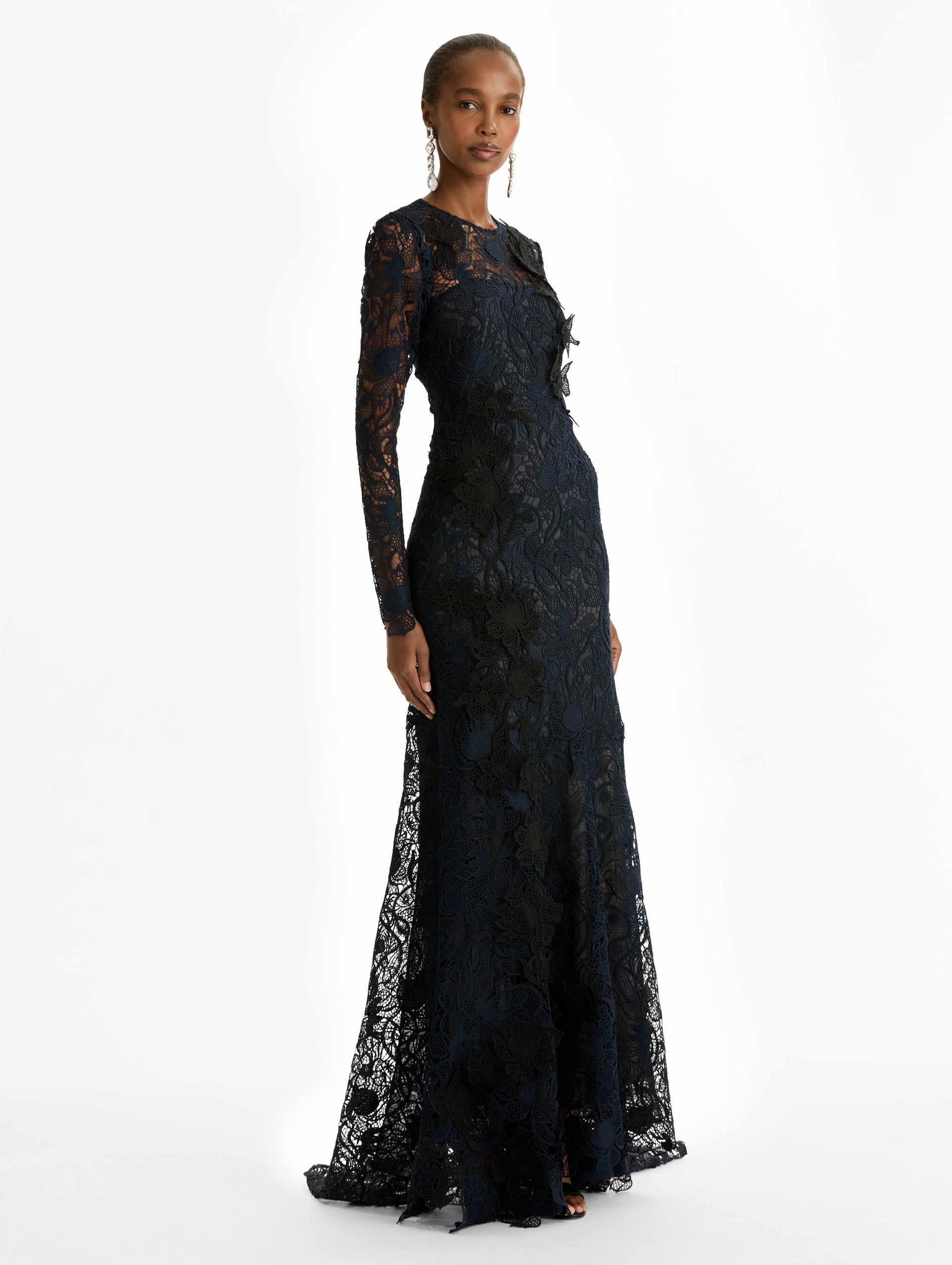 Navy Corded Botanical Guipure Gown with long sleeves and a sheer lace overlay. Side View.