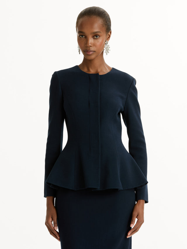 Peplum Wool-Blend Jacket in Navy. Front View.