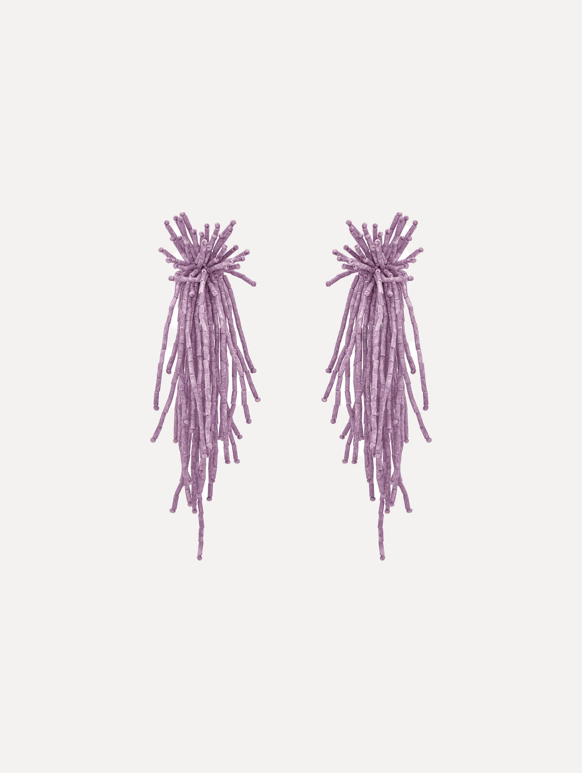 The Firework Tassel Earrings in the color pink.