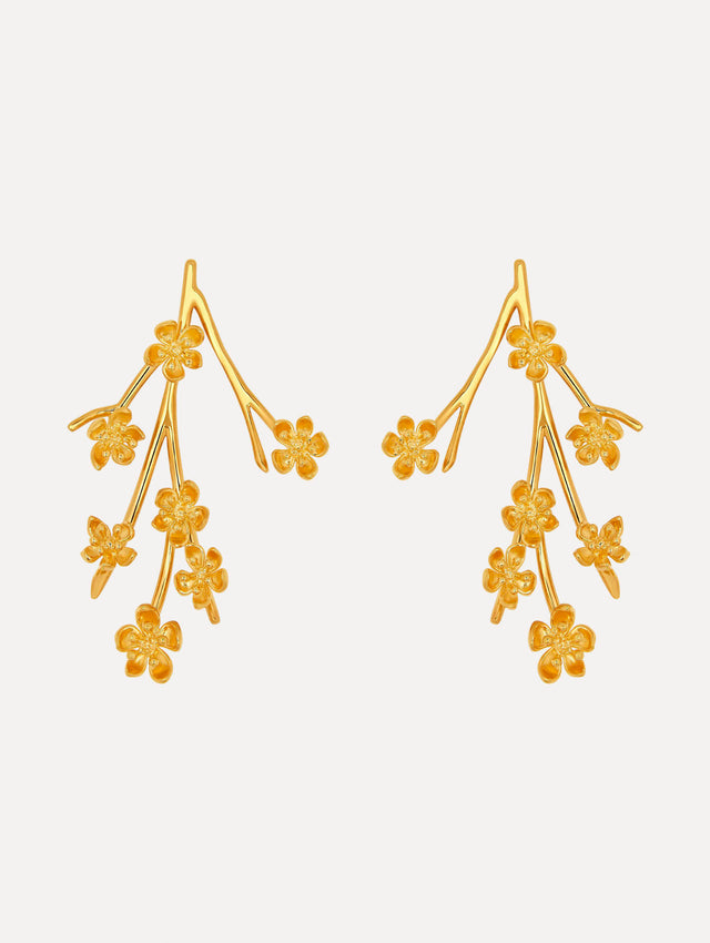 Gold cherry blossom branch earrings. Front view