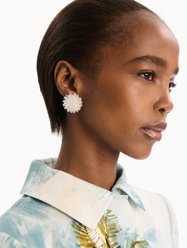 The model is wearing the Beaded Cluster Earrings in Crystal. Detail View.