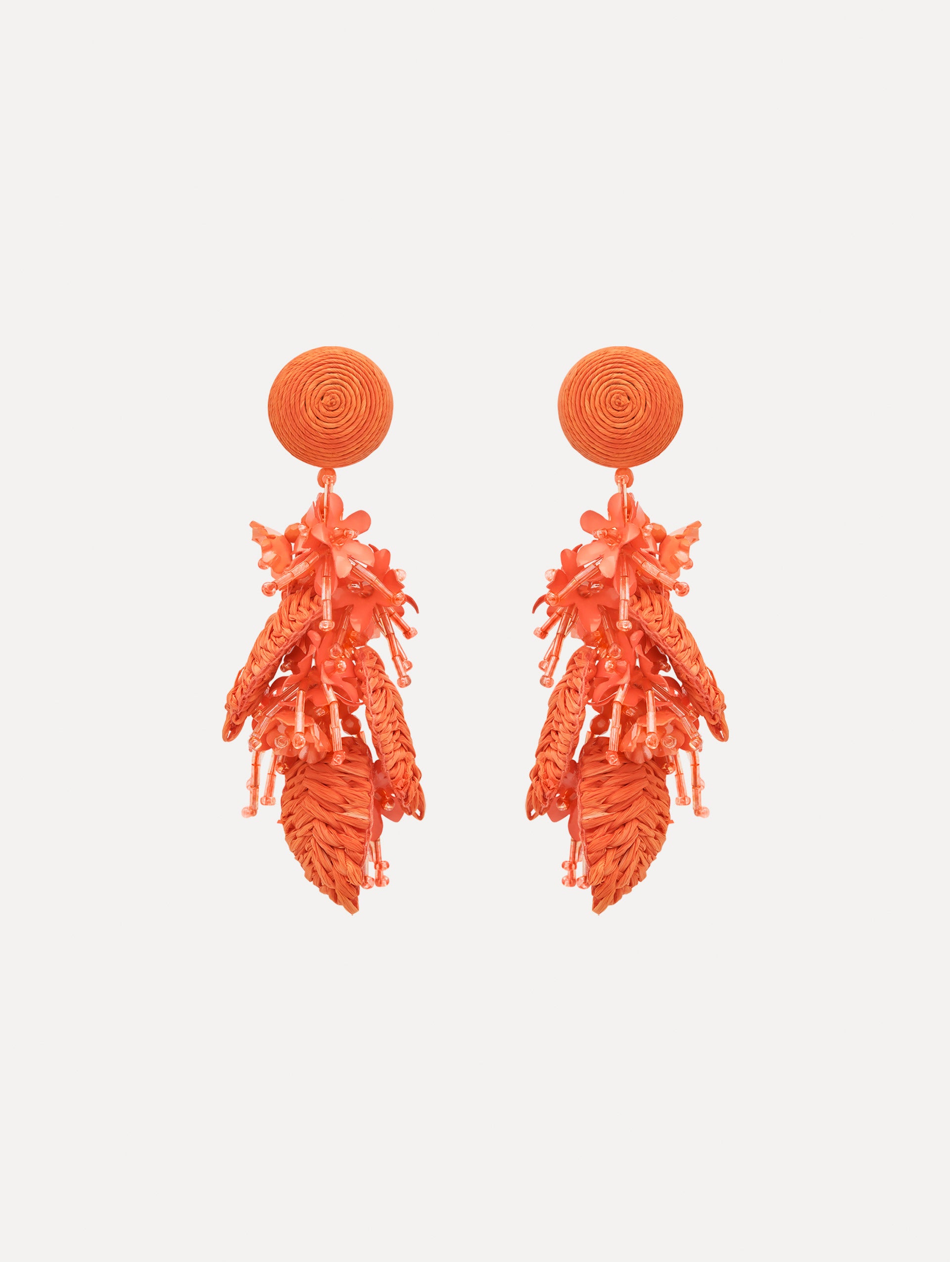The Raffia Tassel Bouquet Clip-On Earrings in Orange. Front View.