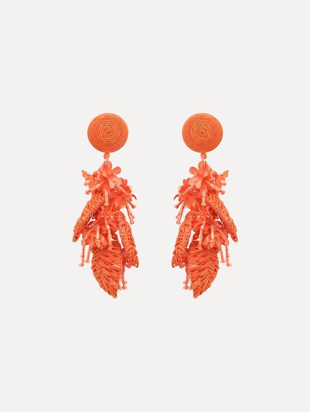 The Raffia Tassel Bouquet Clip-On Earrings in Orange. Front View.