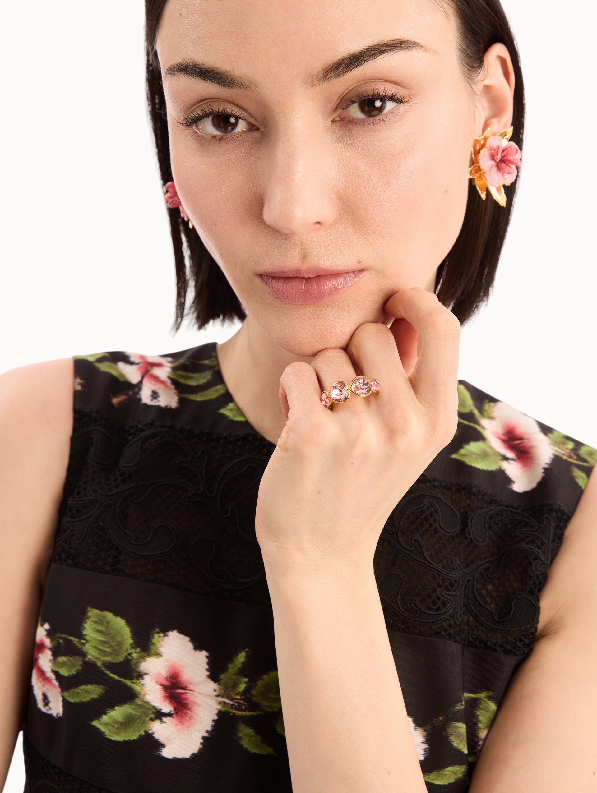 The model is wearing the Crystal Heart Ring in Rose. Detail View.