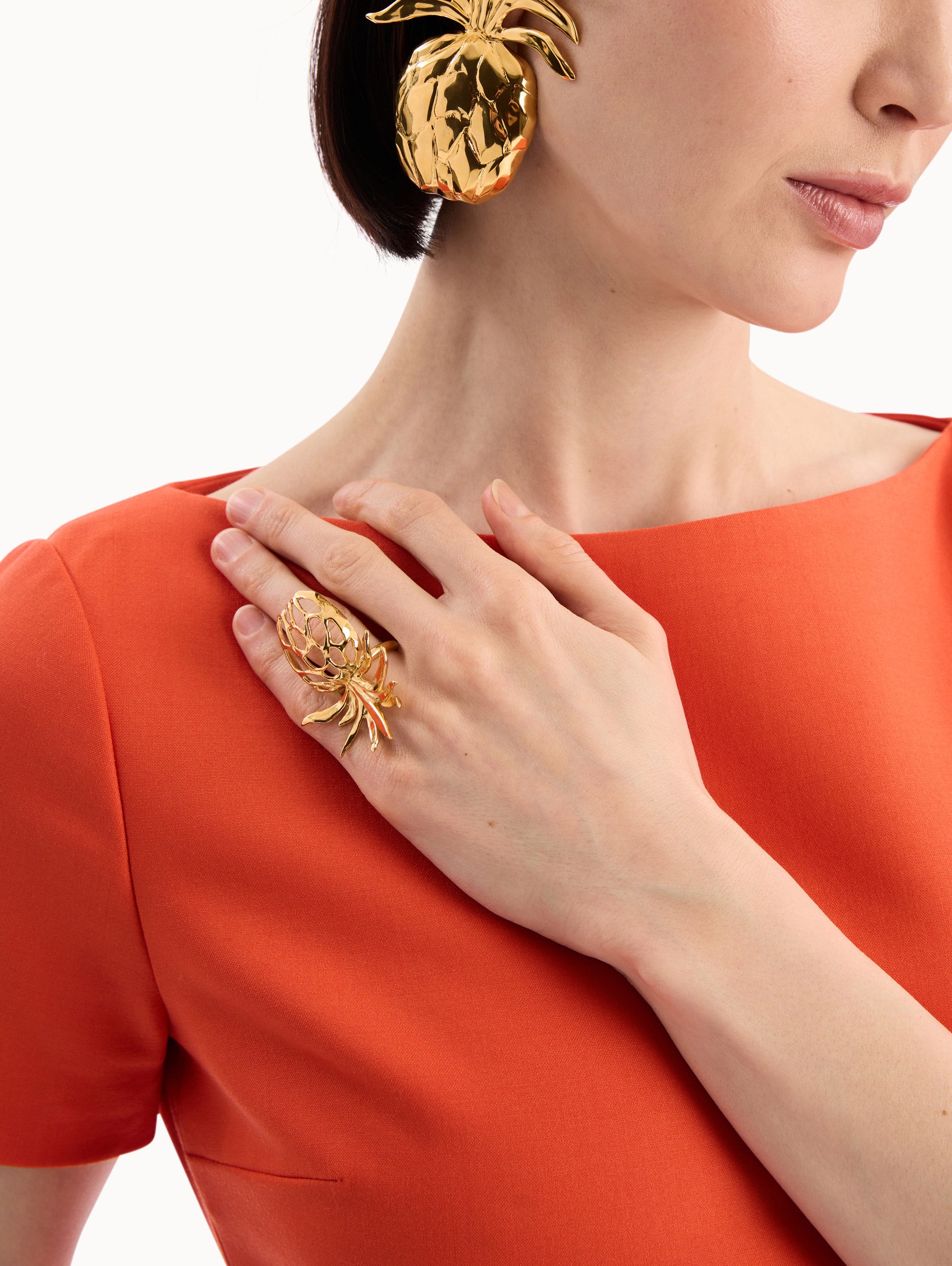 The model is wearing the Openwork Pineapple Ring in Gold. Detail View.