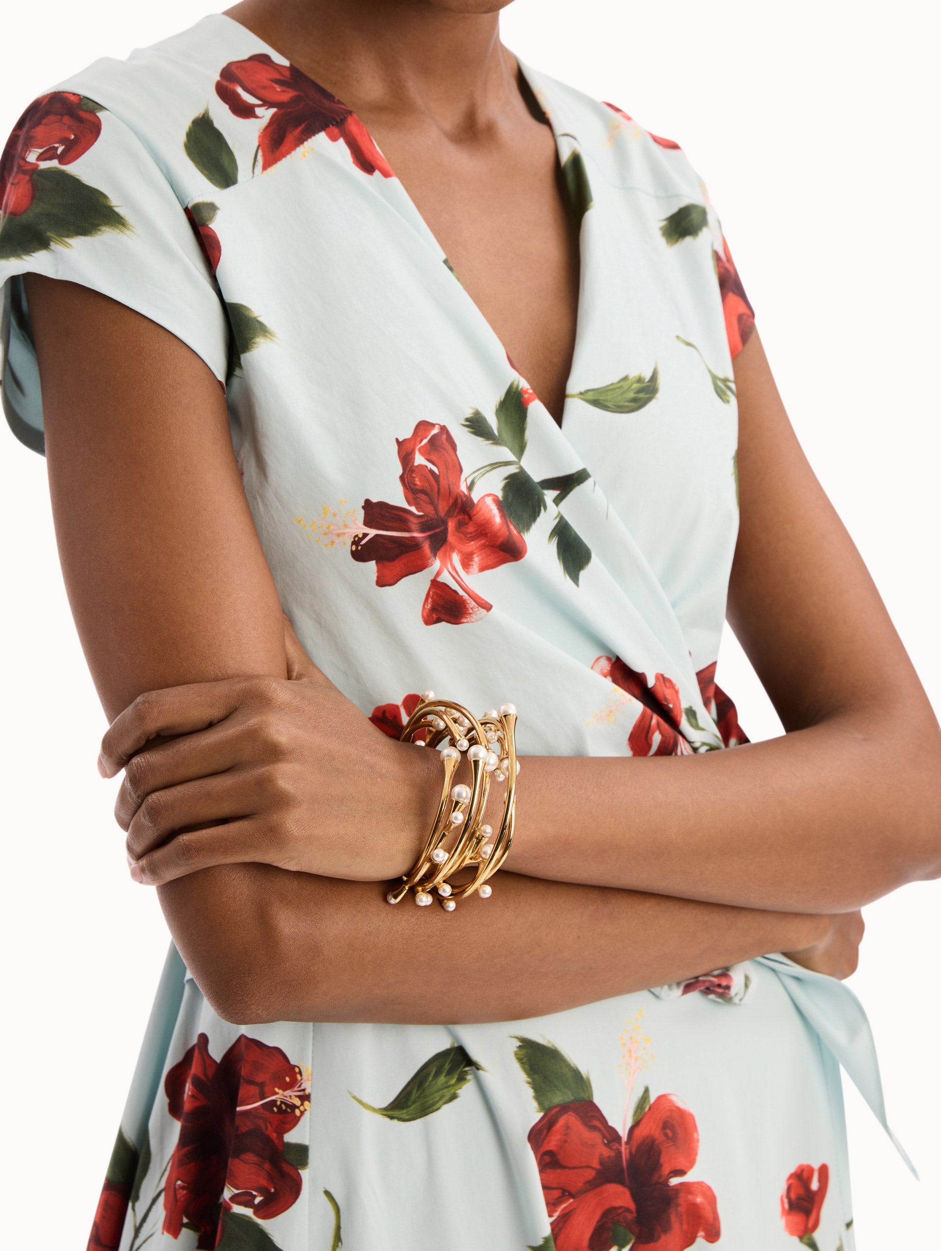 The model is wearing the Pearl Nest Cuff Bracelet in Gold. Detail View.