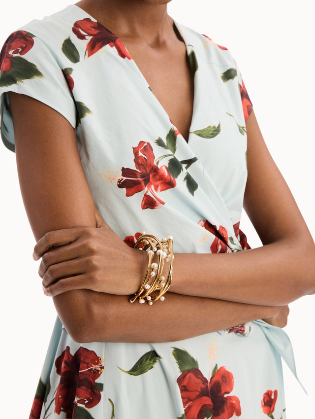 The model is wearing the Pearl Nest Cuff Bracelet in Gold. Detail View.