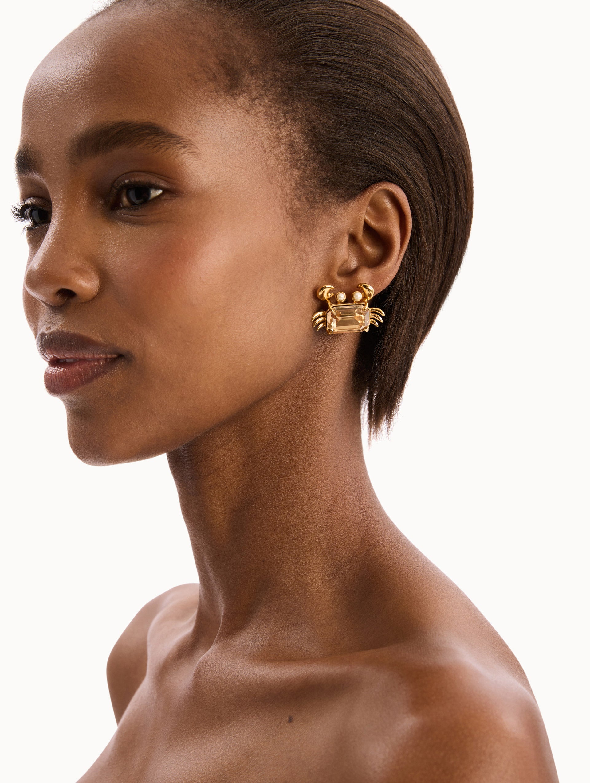 The model is wearing the Crystal Crab Earrings. Detail View.