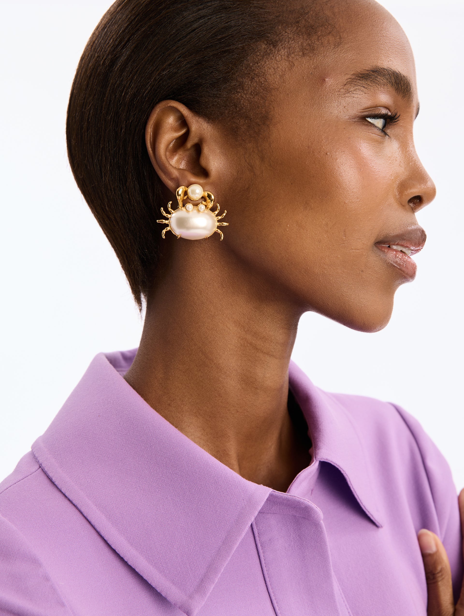 Gold Crab with pearl Shell holding Pearl Post Back Earrings. Front View.
