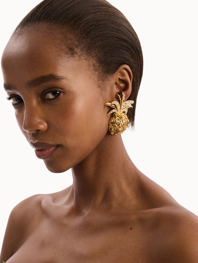 The model is wearing Pineapple Crystal Clip-On Ring in Citrus. Front View.