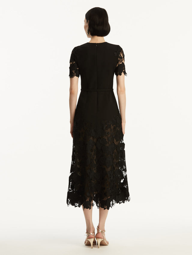 Black Orchid Guipure Lace Inset Short Sleeve Dress with Transparencies in Sleeves and Bottom, and Black Belt.  Back View