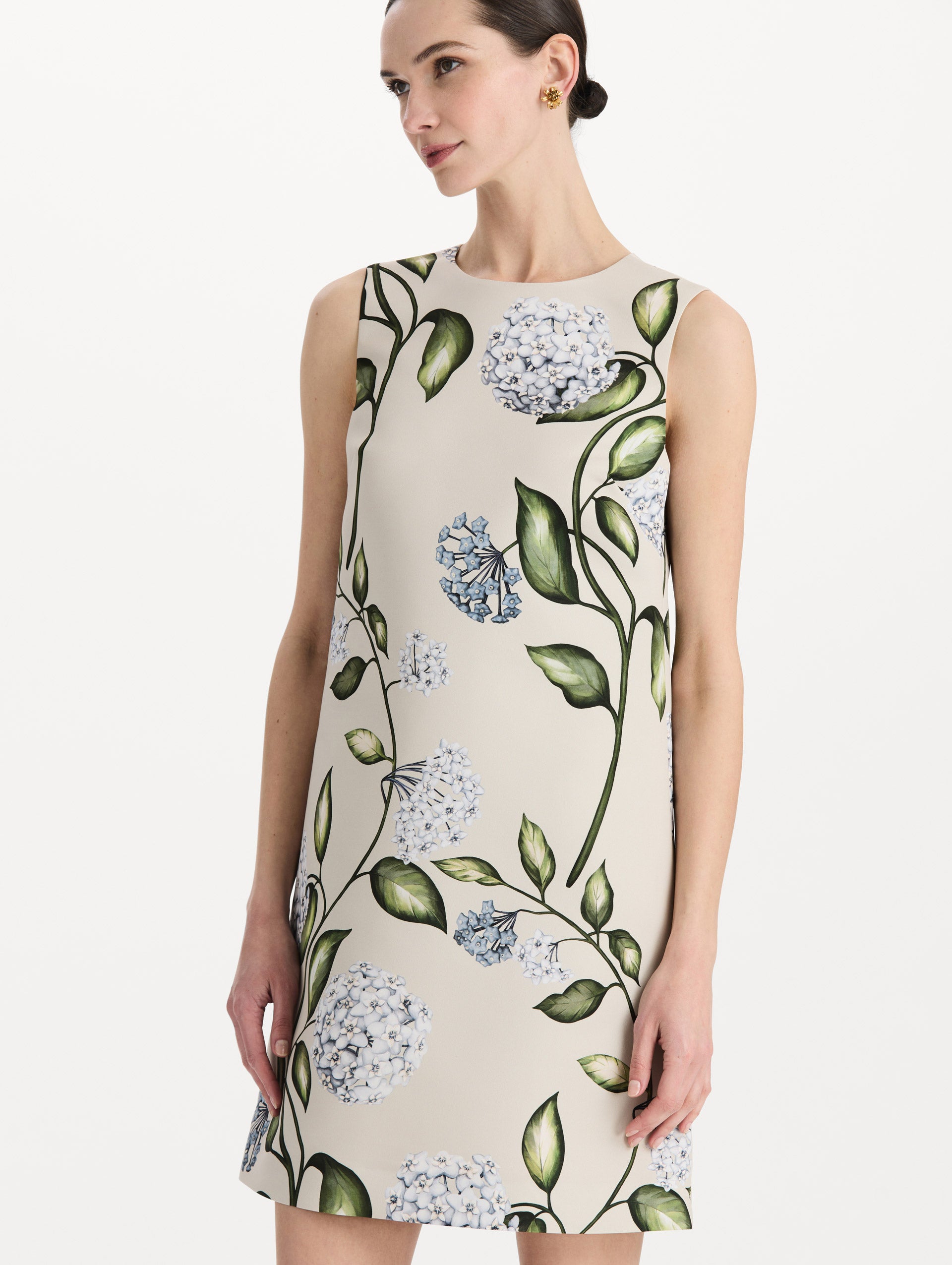 The model is wearing the Porcelain Flower Faille Shift Dress in white featuring a mini-length and printed floral motif. Detail Shot.