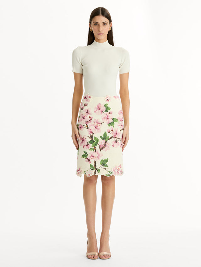 Ivory Cherry Blossom Tweed Pencil Skirt with pink and green floral motifs and knee length hem. Front View.