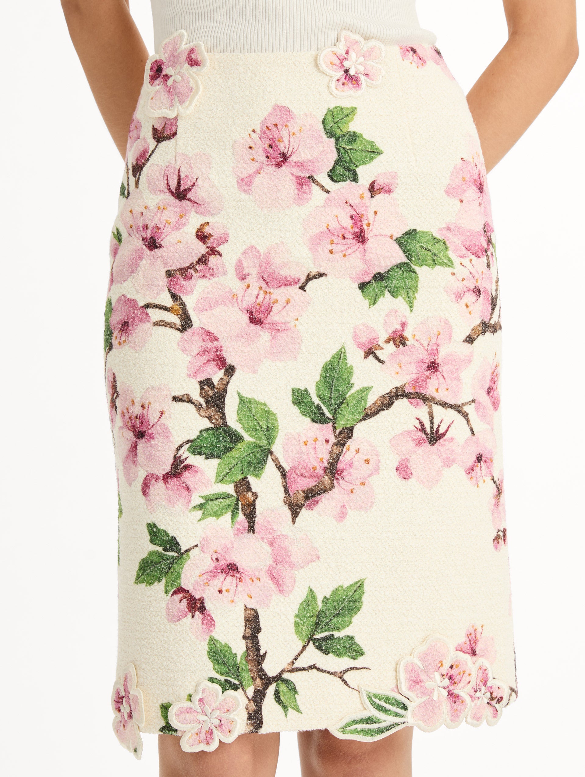 Ivory Cherry Blossom Tweed Pencil Skirt with pink and green floral motifs and knee length hem. Zoom View.
