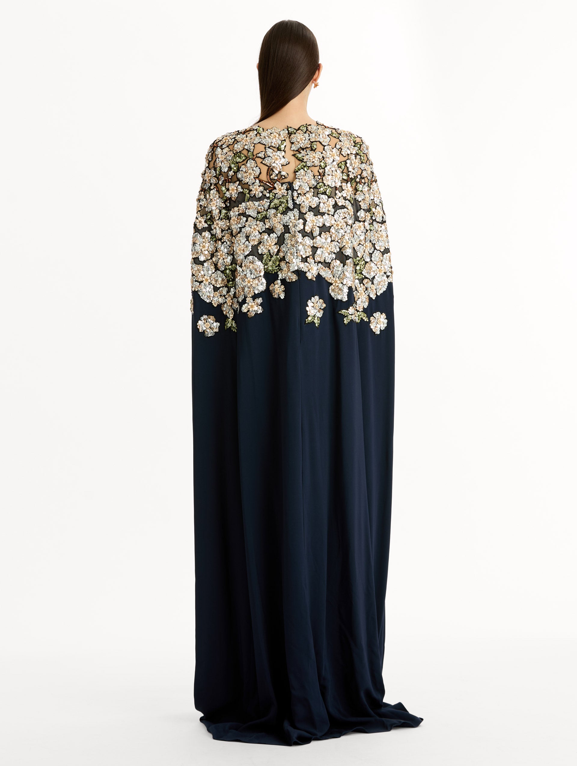 Navy Floral Sequin Embroidered Caftan with floor length caped sleeves and floral sequin embroidery. Back View.