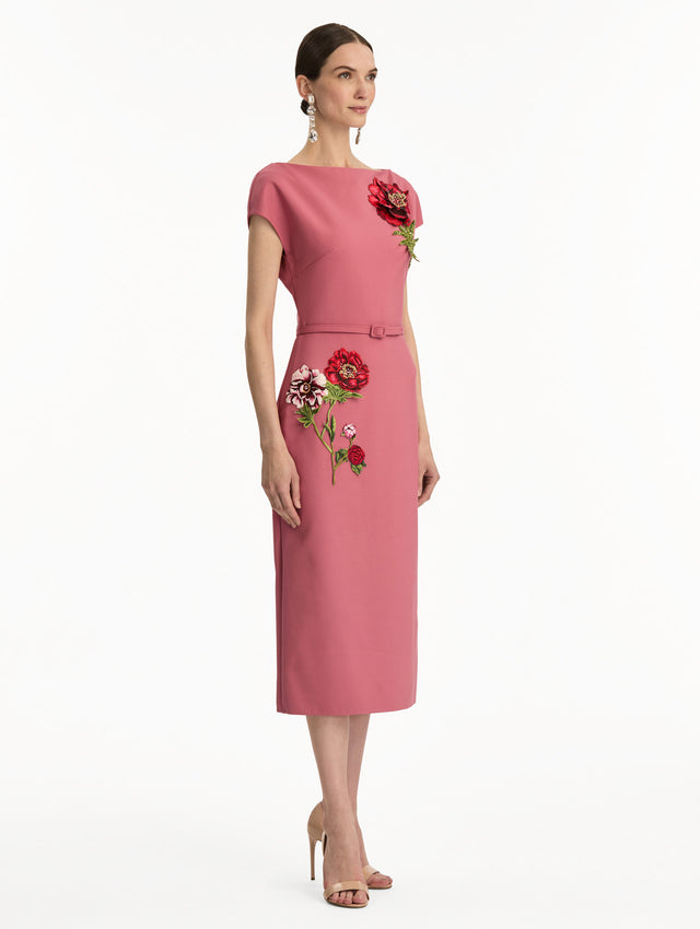 Pink cap sleeve dress with printed red and pink peonies and a matching self-belt. Side view.