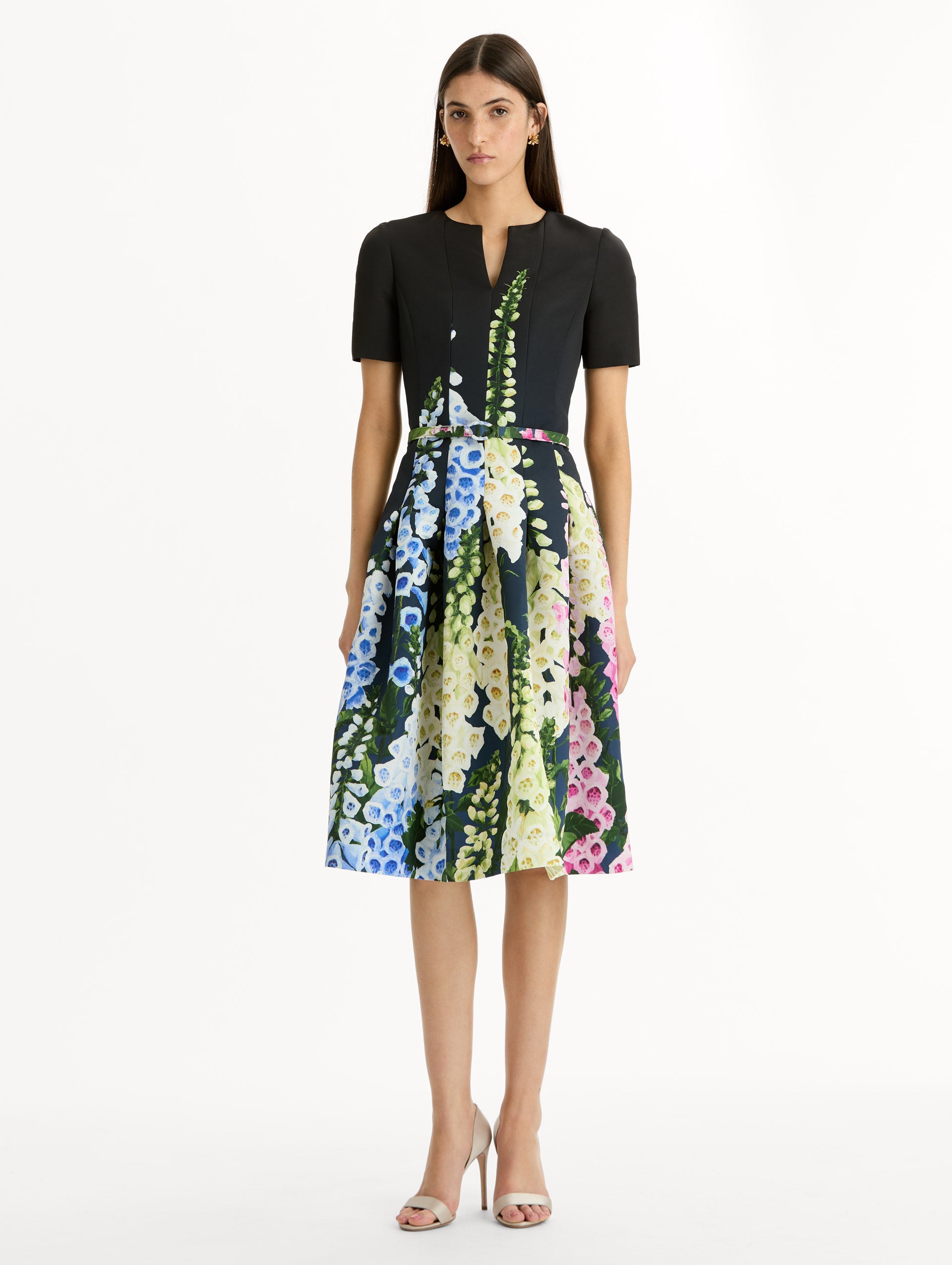 Black floral Degradé Foxglove Split-Neck Dress with belted waist and short sleeves. Front View.